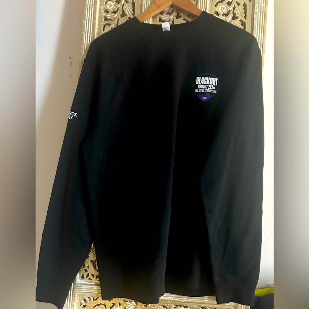 Black Warner Brothers Discovery sweatshirt Blackout Storytelling Summit NYC 2024